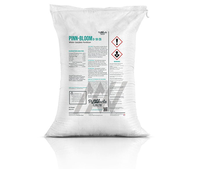 White 25 lb bag of Pinn-Bloom flowering fertilizer with text and symbols on a white background