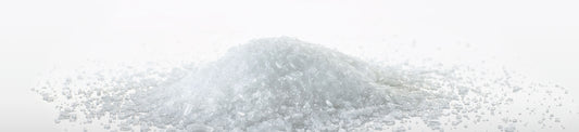 A pile of Magriculture magnesium sulfate heptahydrate rhombic crystals.