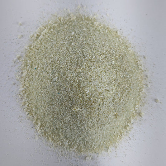 A closeup view of a small pile of MasterBlend 4-18-38 hydroponic tomato fertilizer powder.