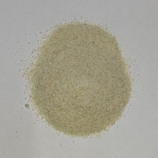 A closeup view of MasterBlend 0-20-42 Cannabis Bloom, a free flowing non-clumping powder fertilizer.