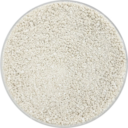 Close-up of off-white Global Feed ferrous sulfate monohydrate granules in a round dish