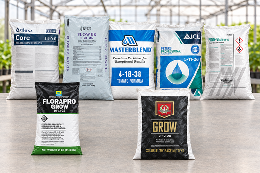 Fertilizer bags from Athena, JR Croptech, MasterBlend, Peters Professional, Pinnacle Grow, FloraPro and House & Garden arranged on a greenhouse bench.