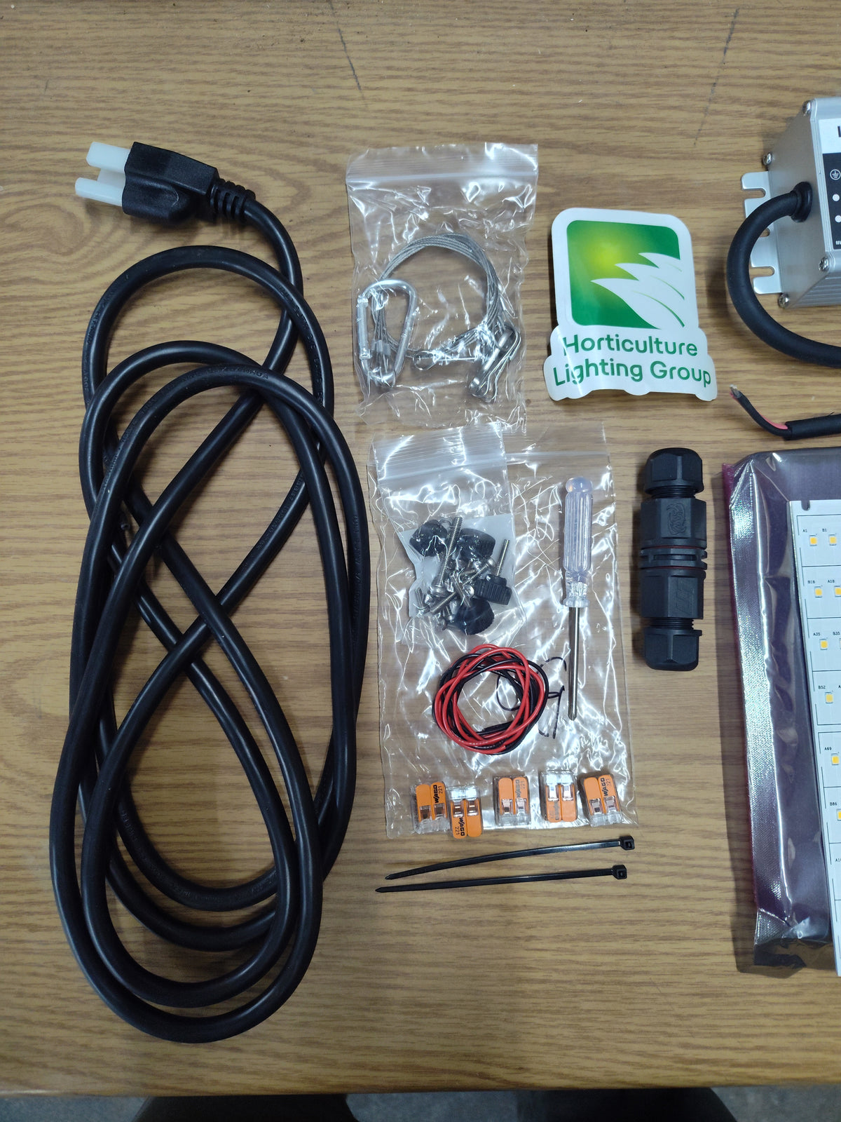 HLG 135 Rspec kit accessories including power cord, hanging cables, wiring connectors and mounting hardware.