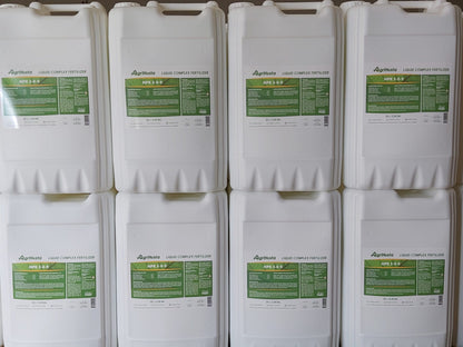 Multiple containers of AgriHusta liquid complex fertilizers with green labels.