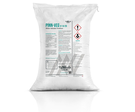 White 25 lb. bag of Pinn-Veg fertilizer with visible branding on a white background