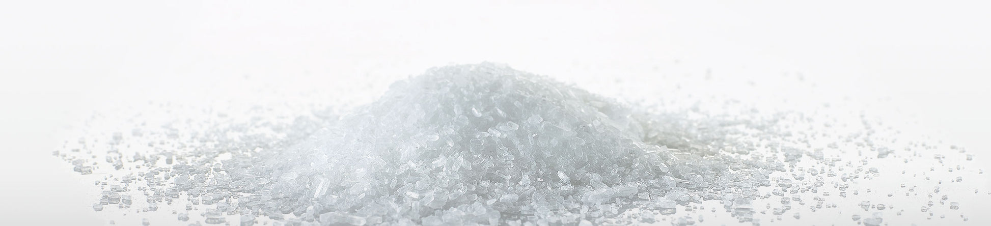 A pile of Magriculture magnesium sulfate heptahydrate rhombic crystals.