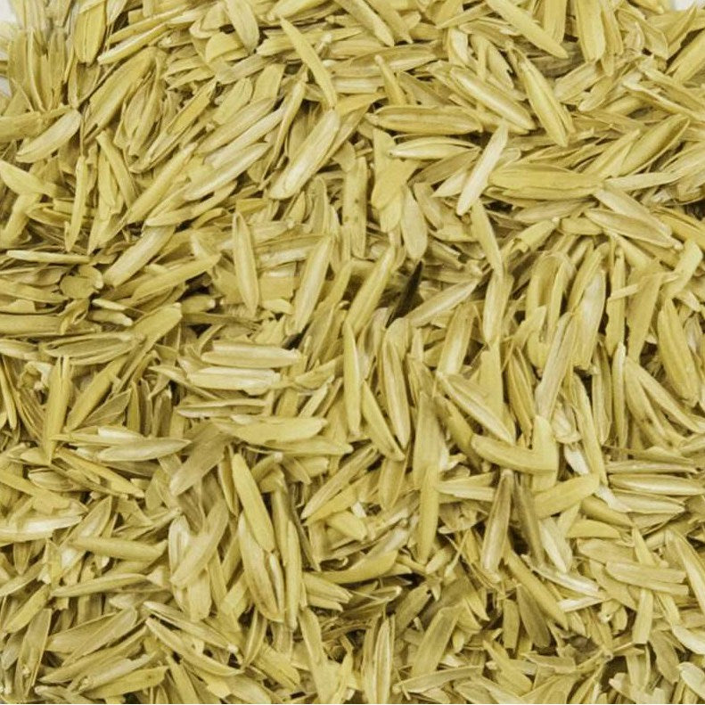 Close-up of yellow rice hulls for soil amendment.
