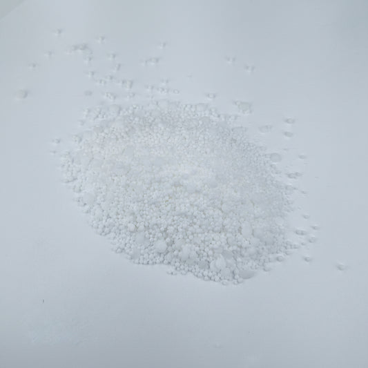 Peters Professional Hydroponic Boost fertilizer small white granules on a light gray background