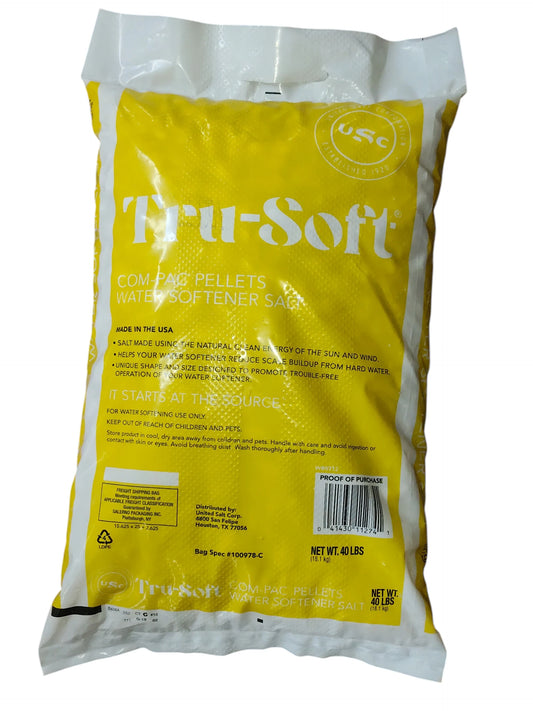 Back view of a Yellow 40 lb, bag of Tru-Soft Com Pac solar water softener salt on a white background