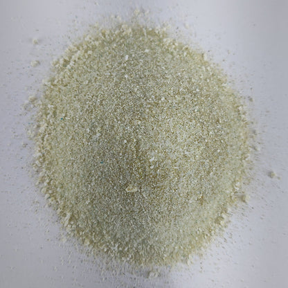 A closeup view of a small pile of MasterBlend 4-18-38 hydroponic tomato fertilizer powder.