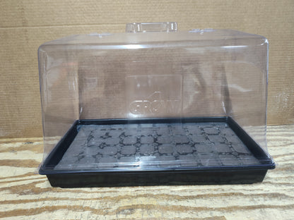 Clear plastic propagation dome with 'Grow1' branding on a black seedling tray against a wooden background